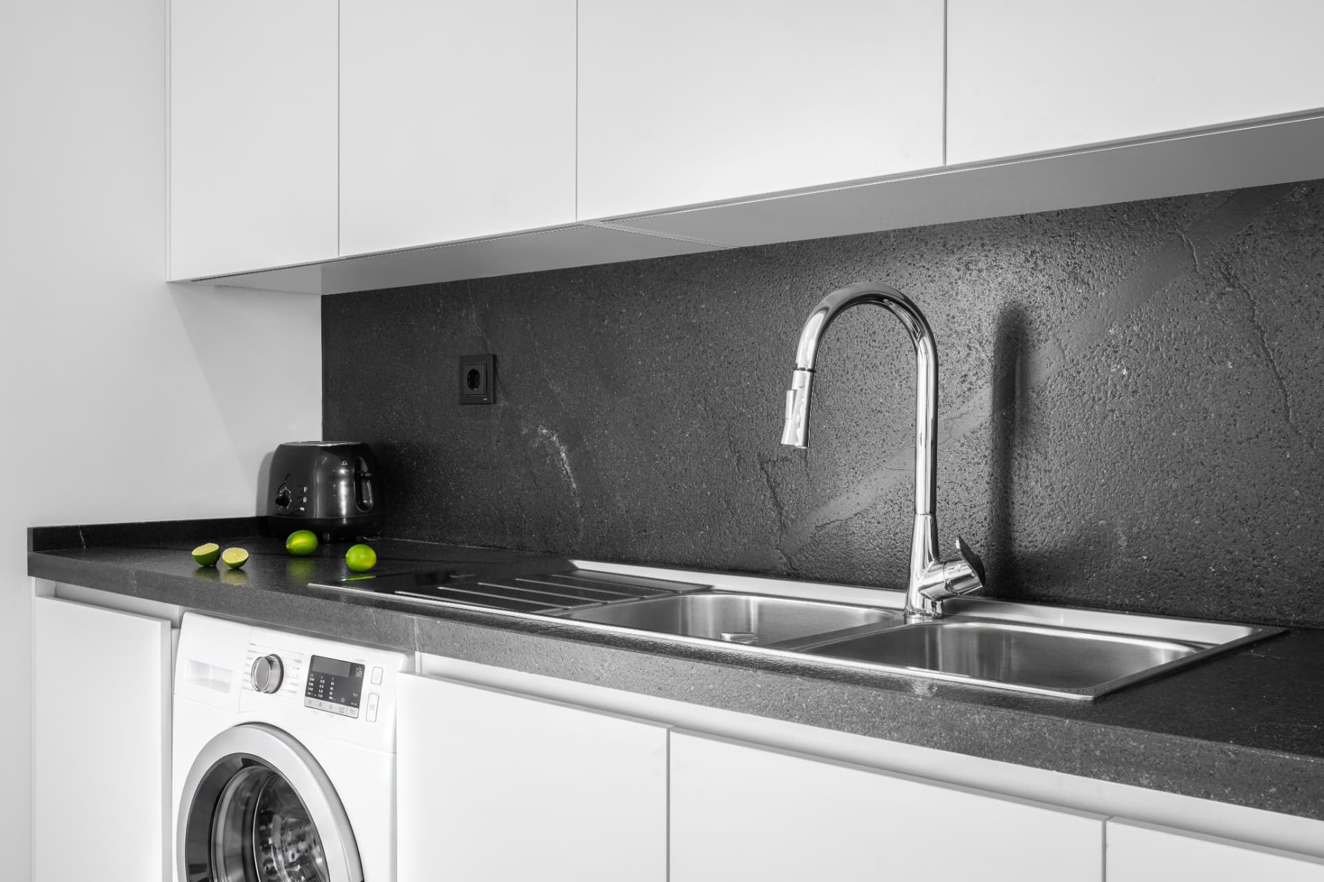 Installed countertop and backsplash in a residential kitchen, view 1